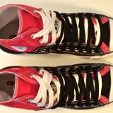 Layer Up High-Low Chucks  Top view of black and red layer up high tops with black and white shoelaces.