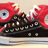 Layer Up High-Low Chucks  Inside patch views of black and red layer up high tops with black and white shoelaces.