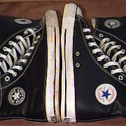 Leather Chucks  Black leather high tops matched with black jewel high tops, side views.