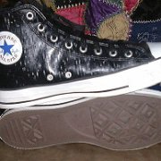 Leather Chucks  Black leather high tops with black laces, inside patch and sole views.