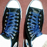 Leather Chucks  Black leather high tops with blue piping and laces.