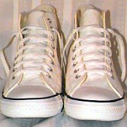 Leather Chucks  White leather jewel high tops, front view.
