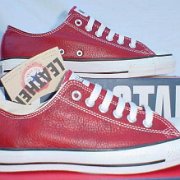 Leather Chucks  Grain leather red low cuts, side views.