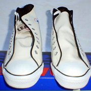 Leather Chucks  Brand new white patent leather high tops, front view.