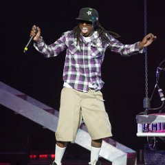 Lil Wayne  Performing in classic black high top chucks.