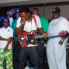 Lil Wayne  Weezy rocking out in red extra high top chucks. (Photo by Ben Rose/WireImage)