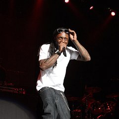 Lil Wayne  Weezy on stage in black chucks.