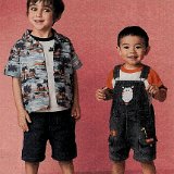 Little Kids Wearing Chucks  Young boy wearing black low cut and toddler wearing red high top chucks.