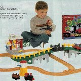 Little Kids Wearing Chucks  Boy in green high tops playing with train.