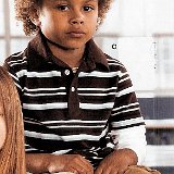 Little Kids Wearing Chucks  Young boy wearing black low cut chucks.