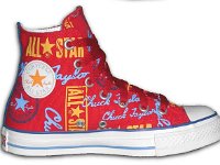 Chucks With Repeated Logo Pattern Uppers  Inside patch view of a left red, sky blue and gold logo print high top with red shoelaces.