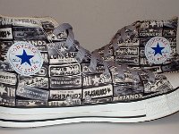 Chucks With Repeated Logo Pattern Uppers  Inside patch views of black and white heel patch print high tops with gray shoelaces.