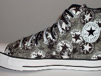 Chucks With Repeated Logo Pattern Uppers  Inside patch view of a right black and white repeat ankle patch print high top with black and white reversible shoelaces.