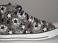 Chucks With Repeated Logo Pattern Uppers  Outside view of a right black and white repeat ankle patch print high top with black and white reversible shoelaces.