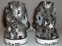 Chucks With Repeated Logo Pattern Uppers  Rear view of black and white repeat ankle patch print high tops.