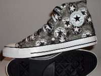 Chucks With Repeated Logo Pattern Uppers  inside patch and sole views of black and white repeat ankle patch print high tops with black and white reversible shoelaces.
