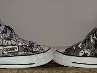 Chucks With Repeated Logo Pattern Uppers  Inside patch view of a wheel of black and white Chuck Taylor logo patch print high tops.