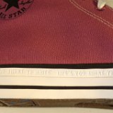 Magenta Renew High Top Chucks  Closeup of the slogan "Life's too short to waste" engraved on the outer foxing.