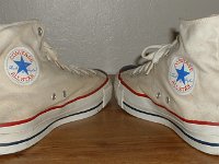 Mark Recob Vintage Chucks Collection  Angled rear view of white weighted blue toe vintage Chuck Taylor All Star high tops.