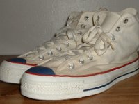 Mark Recob Vintage Chucks Collection  Angled side view of white weighted blue toe vintage Chuck Taylor All Star high tops.