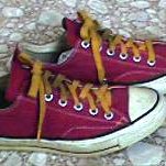 Maroon Low Cut Chucks  Worn maroon low cuts with gold laces, side views.