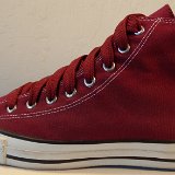 Maroon High Top Chucks  Outside view of a left maroon made in USA high top with fat maroon shoelaces.