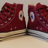 Maroon High Top Chucks  Angled front view of maroon made in USA high tops with fat maroon shoelaces.