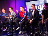 Midnight Red  Band members singing on stools.