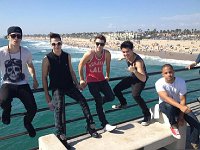 Midnight Red  The band on a pier at the coast.