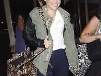 Miley Cyrus  MIley in black high top platform leather chucks.