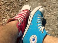 Mismatched Pairs of Chucks  Mismatched red and bright blue high top chucks.