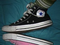 Mismatched Pairs of Chucks  Mismatched black and pink high tops.