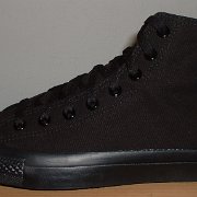 Monochrome Black Chucks  New left black monochrome high top, made in China, outside view.