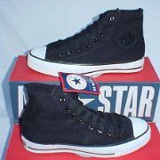 Monochrome Black Chucks  Monochrome high tops that are a manufacturing error: monochrome uppers were placed on the standard black and white rubber outsole and foxing.