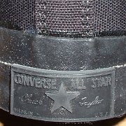 Monochrome Black Chucks  New monochrome black high top, made in USA, closeup of the rear heel patch.