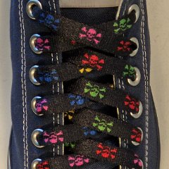 Multi Color Skulls Shoelaces on Chucks  Multi-colored shoelace on a navy blue low top chuck.