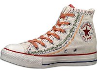 Multicultural High Top Chucks  Catalog view of a right parchment multicultural high top chuck with red pattern shoelaces.