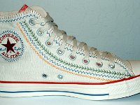 Multicultural High Top Chucks  Inside patch view of a left parchment with red, blue, and orange trim multicultural high top.