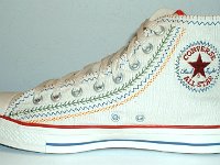 Multicultural High Top Chucks  Inside patch view of a right parchment with red, blue, and orange trim multicultural high top.