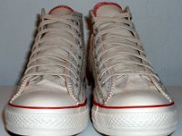 Multicultural High Top Chucks  Front view of parchment with red, blue, and orange trim multicultural high tops.