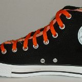 Multilayer High Top Chucks  Inside patch view of a right black multilayered high top with orange laces.