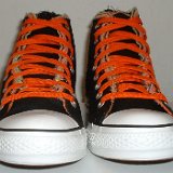 Multilayer High Top Chucks  Front view of black multilayered high tops with orange laces.