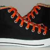 Multilayer High Top Chucks  Outside views of black multilayered high tops with orange laces.