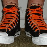 Multilayer High Top Chucks  Wearing black multilayered high tops. front view shot 1.