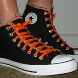 Multilayer High Top Chucks  Wearing black multilayered high tops. right side view shot 1.