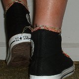 Multilayer High Top Chucks  Wearing black multilayered high tops. rear view shot 2.