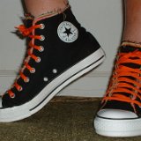 Multilayer High Top Chucks  Wearing black multilayered high tops. left side view shot 2.