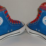 Multilayer High Top Chucks  Angled rear view of royal blue multilayered high tops with red laces.