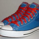 Multilayer High Top Chucks  Angled side view of royal blue multilayered high tops with red laces.