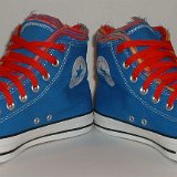 Multilayer High Top Chucks  Angled front view of royal blue multilayered high tops with red laces.